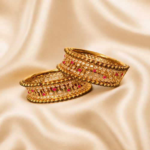 a pair of gold plated openable ad bangles in size 2.6 a pair of gold plated openable ad bangles in size 2.6